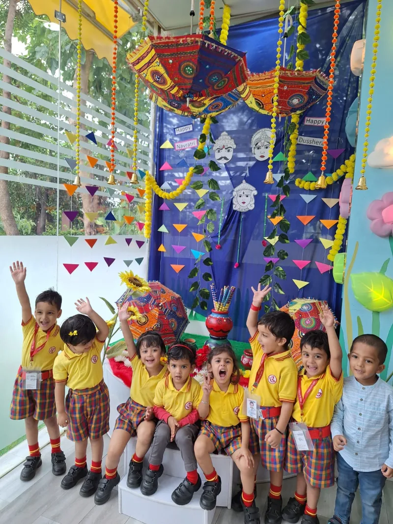UKG children celebrating together in their school uniforms
