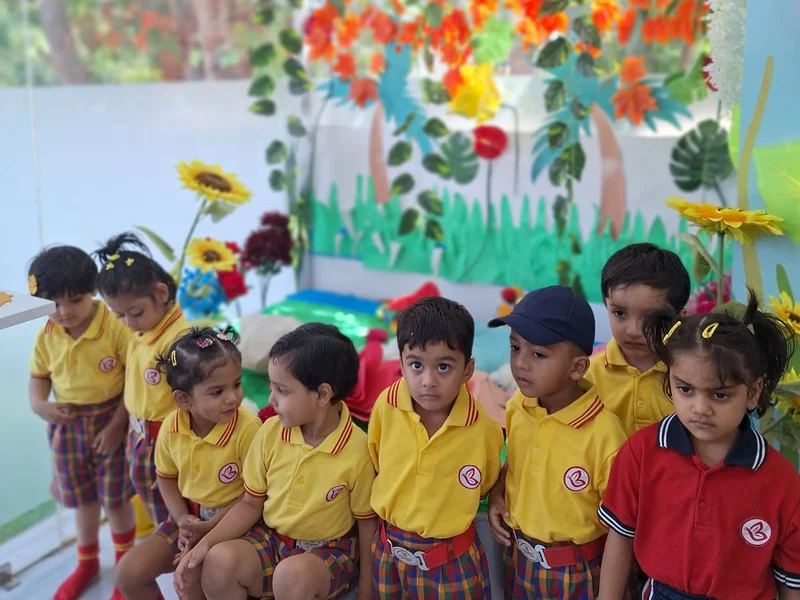 LKG children gathered together in a colourful themed learning corner