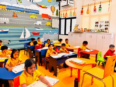 Children practising writing and homework at their desks