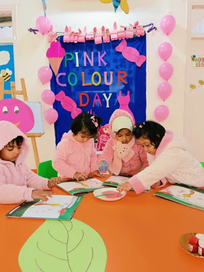 Nursery children enjoying a hands-on painting activity together