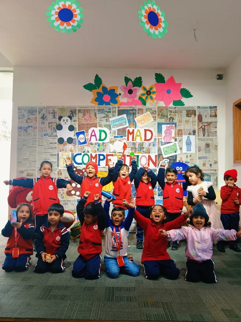 Children cheering with handmade props during the Ad-Mad Competition