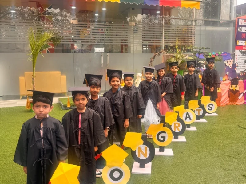 Prep children in graduation caps and gowns, ready for Class 1
