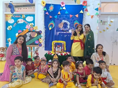 UKG teachers and children dressed up for a Janmashtami celebration