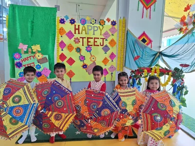 Prep children celebrating Teej with colourful umbrellas